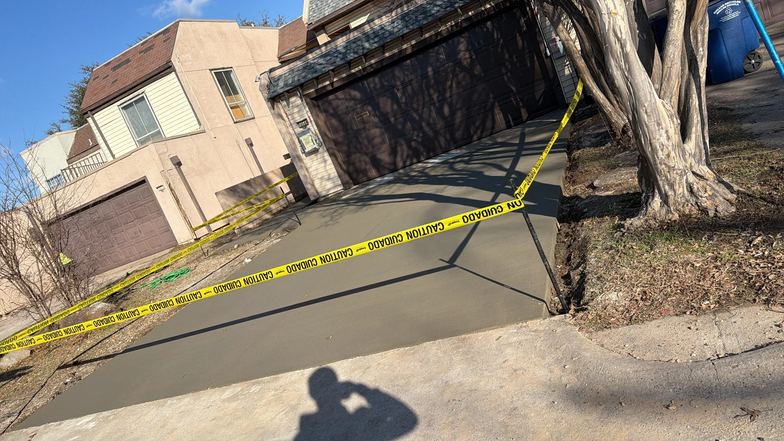 Finished backyard concrete work in a fenced North Texas yard