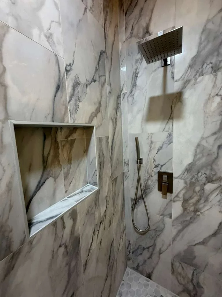 Shower wall tile and recessed niche during a Dallas bathroom project