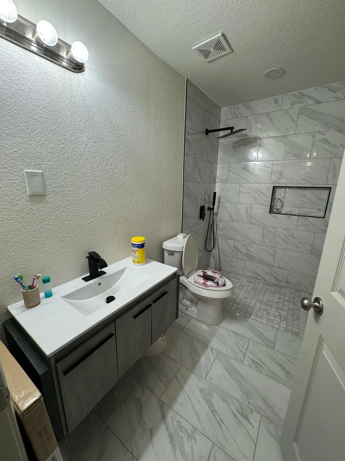 Bathroom vanity and walk-in shower after a Dallas remodel