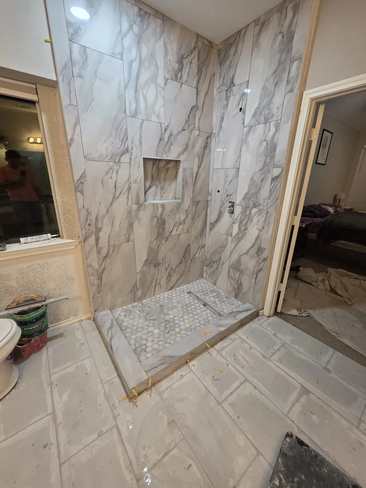 Low-threshold tiled shower built for easier bathroom access